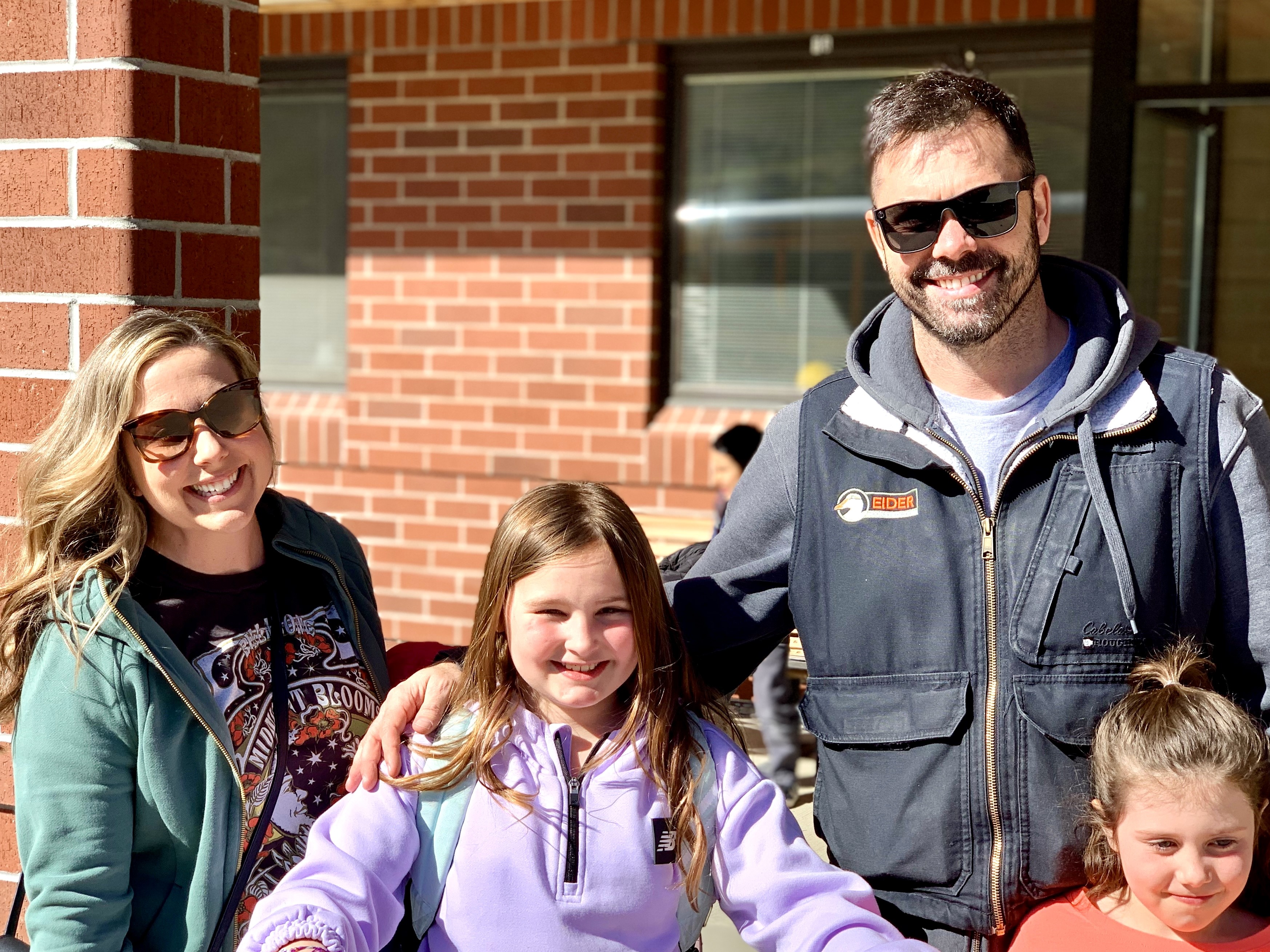 A happy Earn-a-Bike family